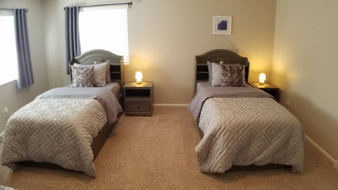 two single beds inside a room