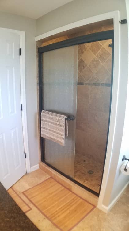 shower room with opened sliding glass door