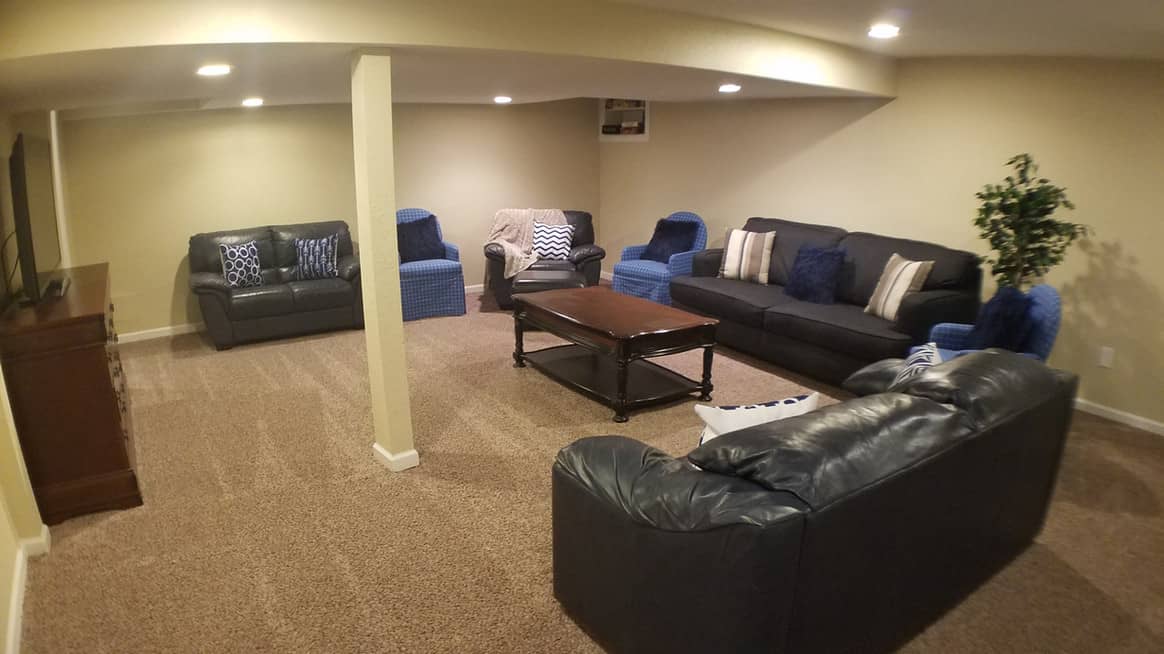 large living room with sofas and flat screen TV