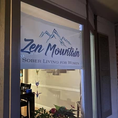 Zen Mountain Sober Living for Women banner displayed on window